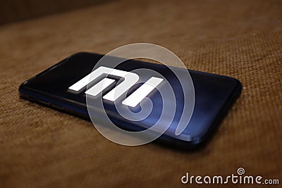 Smartphone with the logo of Xiaomi Inc., is a company dedicated Editorial Stock Photo