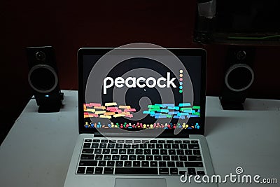 Smartphone with the Peacock logo, is an upcoming video on demand service. Editorial Stock Photo