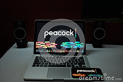 Smartphone with the Peacock logo, is an upcoming video on demand service. Editorial Stock Photo