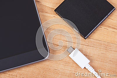 Smartphone, plug of charger and telephone battery, telephone charging Stock Photo