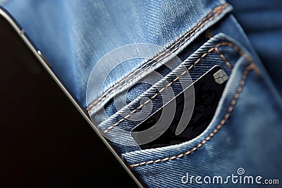 Smartphone in pocket jeans closeup with small card. Generate Ai Stock Photo