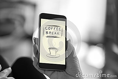 Coffee break concept on a smartphone Stock Photo