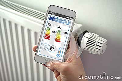 Smartphone with smarthome control app with energy efficiency classes Stock Photo