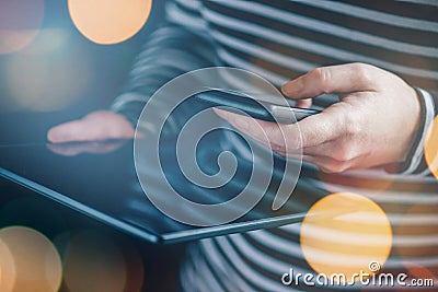 Smartphone and tablet data synchronization, woman transfering files Stock Photo