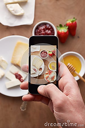 Smartphone taking picture of breakfast Stock Photo