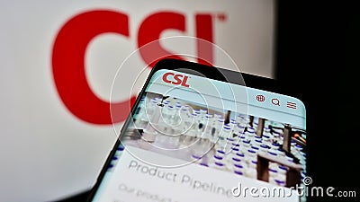 Smartphone with web page of Australian pharmaceuticals company CSL Limited on screen in front of business logo. Editorial Stock Photo