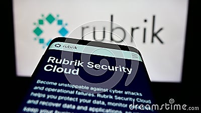 Smartphone with website of US data security company Rubrik Inc. on screen in front of business logo. Editorial Stock Photo