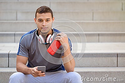 Smartphone young latin man runner jogger sport sports copyspace copy space Stock Photo