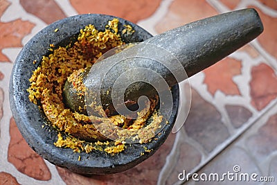 Smashing is a method of grinding spices and mixing them together. Stock Photo