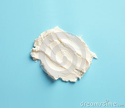 Smear of tasty cream cheese on color background Stock Photo