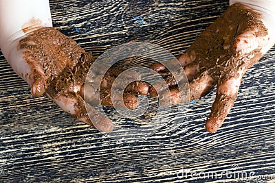 smeared in chocolate hands Stock Photo