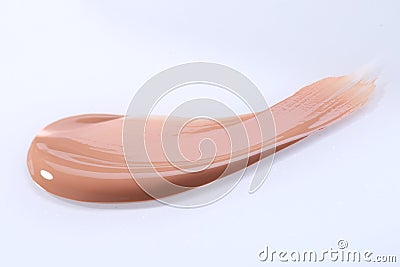 Smeared Liquid Beige Make Up Foundation on White Background Stock Photo