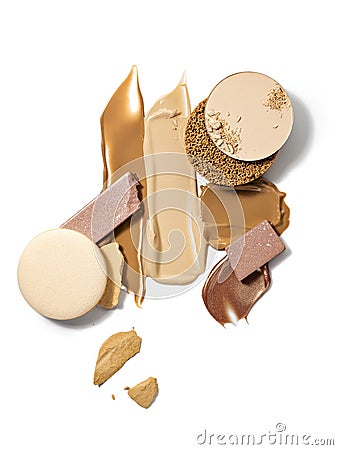 Smears of makeup foundation, eyeshadow, face powder and shimmering powder. Stock Photo