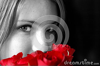 Smelling red roses Stock Photo