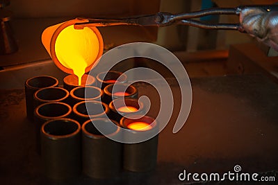 Smelting gold at a factory Stock Photo