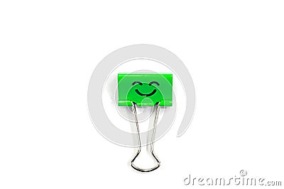 Smile green binder clip on white background Stock Photo