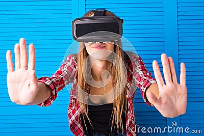 Smile happy woman getting experience using VR-headset glasses of virtual reality at home much gesticulating hands Stock Photo