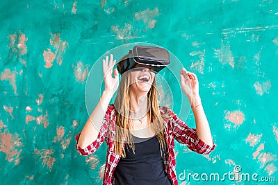 Smile happy woman getting experience using VR-headset glasses of virtual reality much gesticulating hands Stock Photo