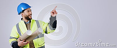 Smile, pointing and man engineer with blueprint in studio with mockup space for advertising. Happy, marketing and male Stock Photo