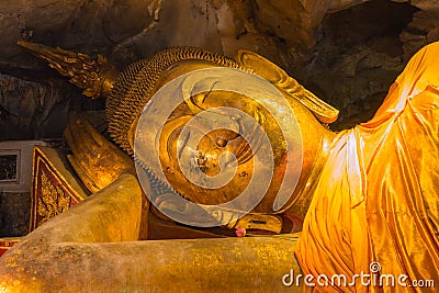 Smile Reclining Buddha statue, nirvana position Stock Photo