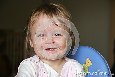 Smile in smear baby face Stock Photo