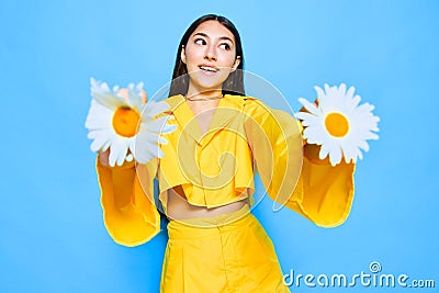 woman young happiness flower love yellow chamomile blue smile model portrait Stock Photo