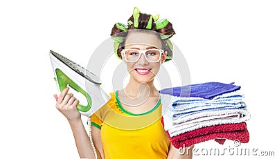 Smile woman holding iron and towels. Stock Photo