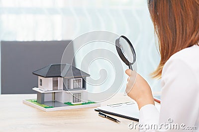 Smile woman searching for new home or inspecting homes before bu Stock Photo