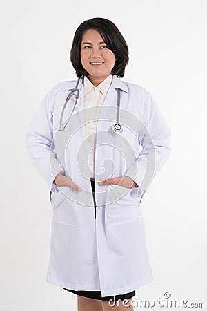 Smiled kindness asian female doctor standing isolated on white background Stock Photo