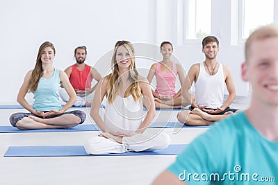 Smiled young people meditating Stock Photo