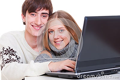 Smiley couple with laptop Stock Photo