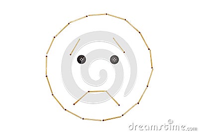 Smiley expressing emotion sorrow is made of matches on a white background Stock Photo