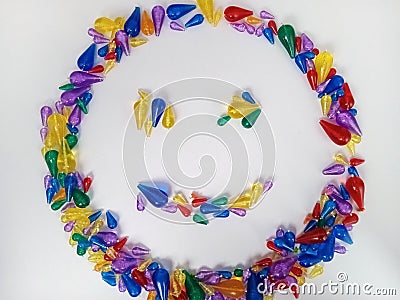 Smiley face with colorful beads on a white background Stock Photo