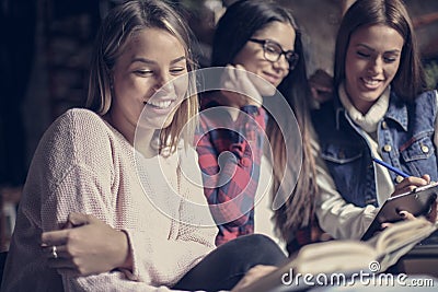 Smiley students girls learning together. Stock Photo