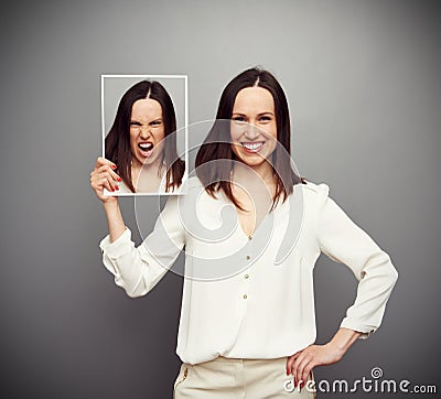 Smiley woman angry inside Stock Photo