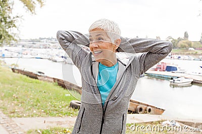 Smiling Active Old Woman Doing Fitness Exercise Stock Photo