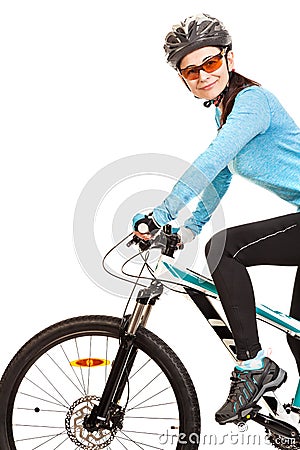 Smiling adult woman cyclist riding a bicycle. Stock Photo