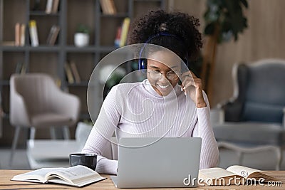 Happy biracial female student study distant on laptop Stock Photo