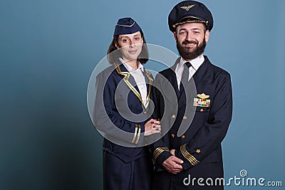 Smiling airplane captain and flight attendant Stock Photo