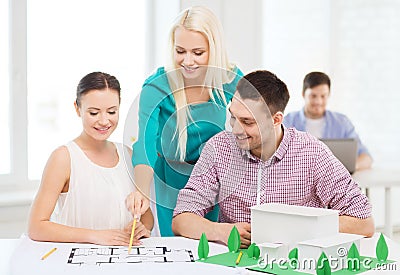 Smiling architects working in office Stock Photo