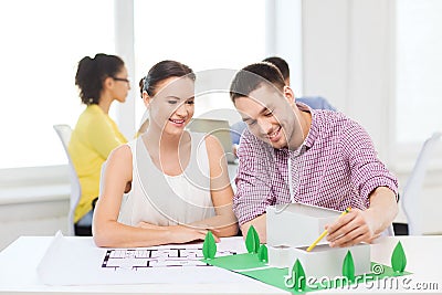 Smiling architects working in office Stock Photo