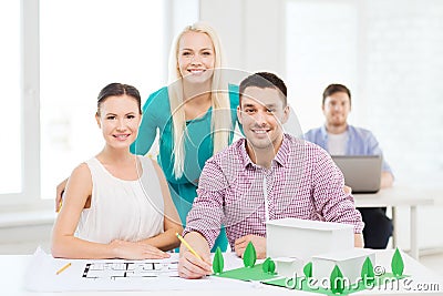 Smiling architects working in office Stock Photo