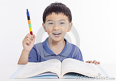 Smiling asian child schoolboy studying and drawing at home Stock Photo