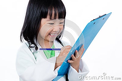 Smiling Asian Chinese Little Doctor Writting On Clip Board Stock Photo