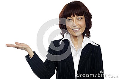 Smiling asian female presenting copy space Stock Photo