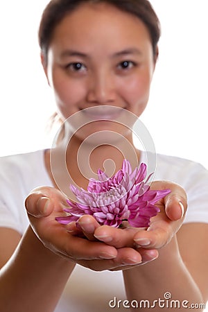 Smiling asian girl with a flower Stock Photo