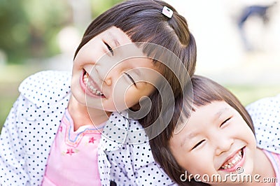 Smiling asian twin girls Stock Photo