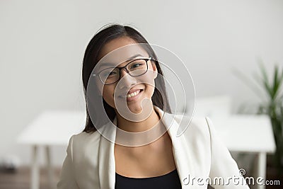 Smiling asian woman in glasses looking at camera, headshot portr Stock Photo