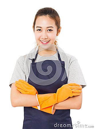 Smiling Asian Woman Standing With Arms Crossed Wearing Apron And Rubber Gloves. Stock Photo