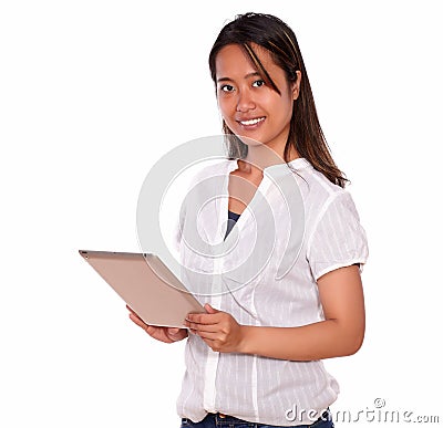 Smiling asiatic young woman using her tablet pc Stock Photo